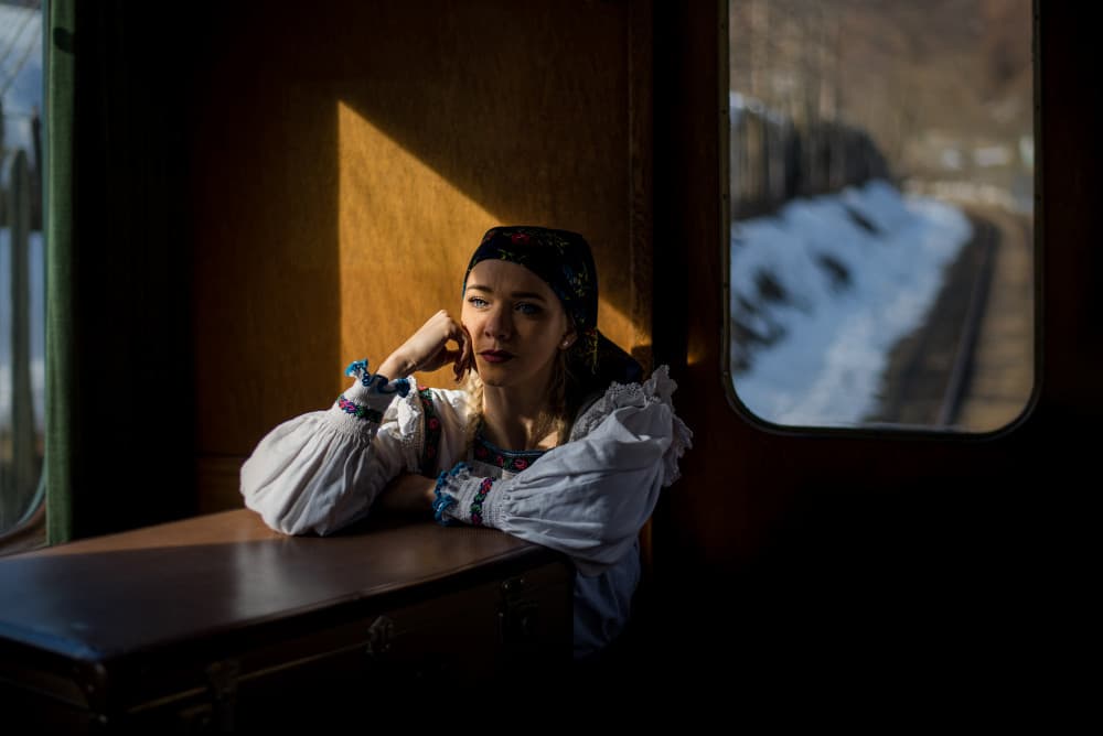 Woman in Train Light by Doru Petrutiu — canvas wall art