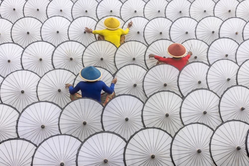 People Making Umbrellas by Sally Widjaja — canvas wall art