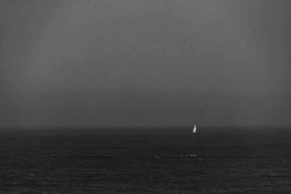 Solitary Sailboat Sea by Miguel Silva — canvas wall art