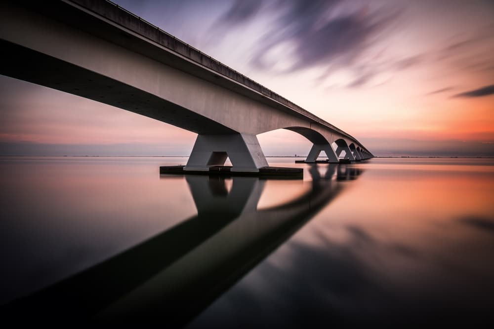 Serene Bridge Reflections by Sus Bogaerts — canvas wall art