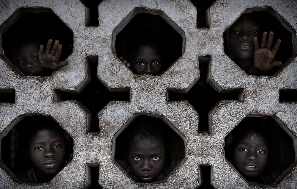 Curious Faces In Wall by Joxe Inazio Kuesta Garmendia — canvas wall art