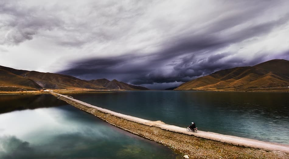 Stormy Lake Path Ride by Nicolas Marino — canvas wall art