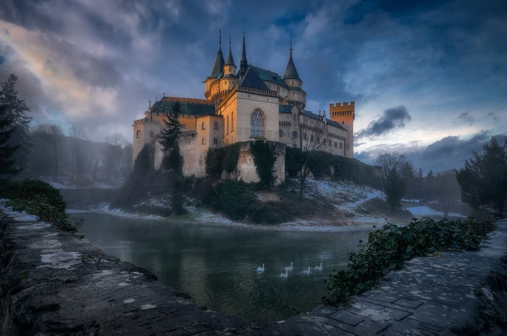 Enchanted Castle Lake Swans by Karol Važan — canvas wall art