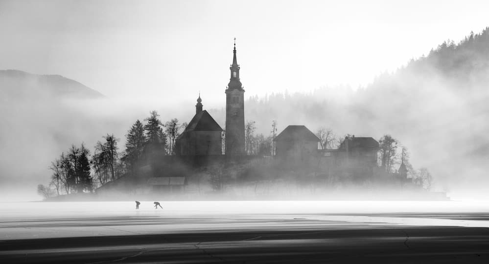 Misty Island Skaters by Ales Krivec — canvas wall art