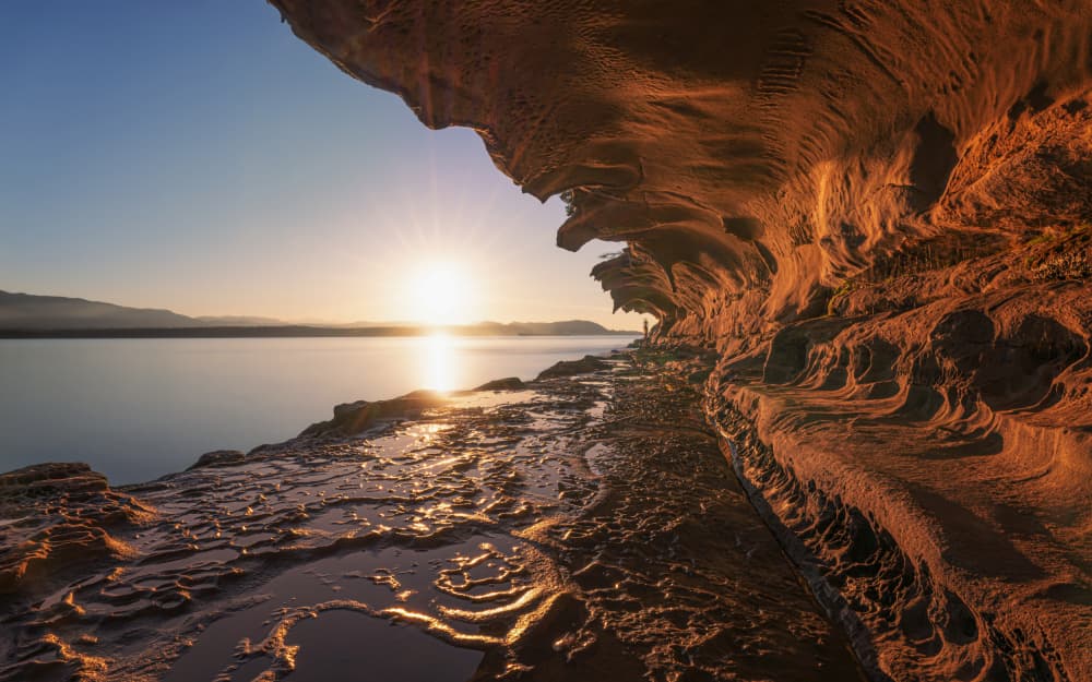 Sunlit Coastal Grotto by Cher Gu — canvas wall art