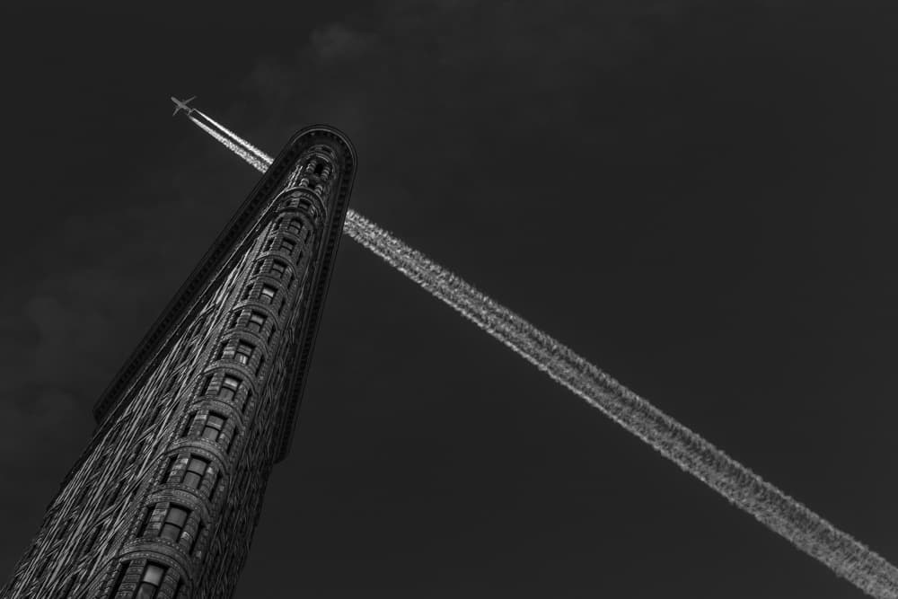 Flatiron Building Contrail by Michael Jurek — canvas wall art