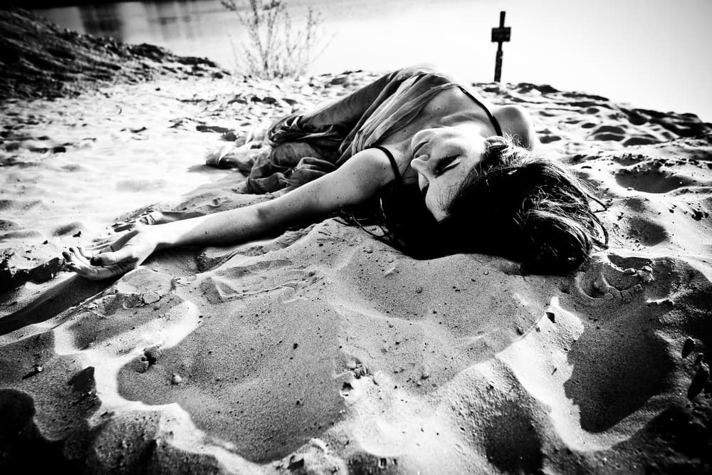Serene Woman on Sand by Erkan Camlilar — canvas wall art