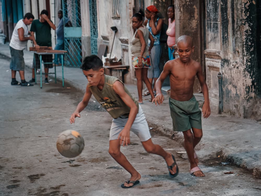 Boys Playing Street Soccer by Andy Bauer — canvas wall art