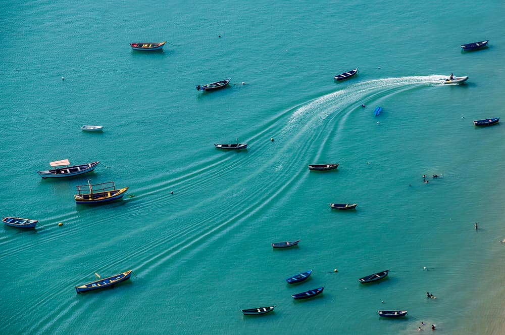 Tropical Boats Clear Water by Chechi Peinado — canvas wall art