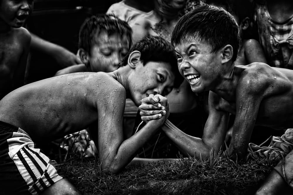 Fierce Childhood Arm Wrestle by Adhi Prayoga — canvas wall art