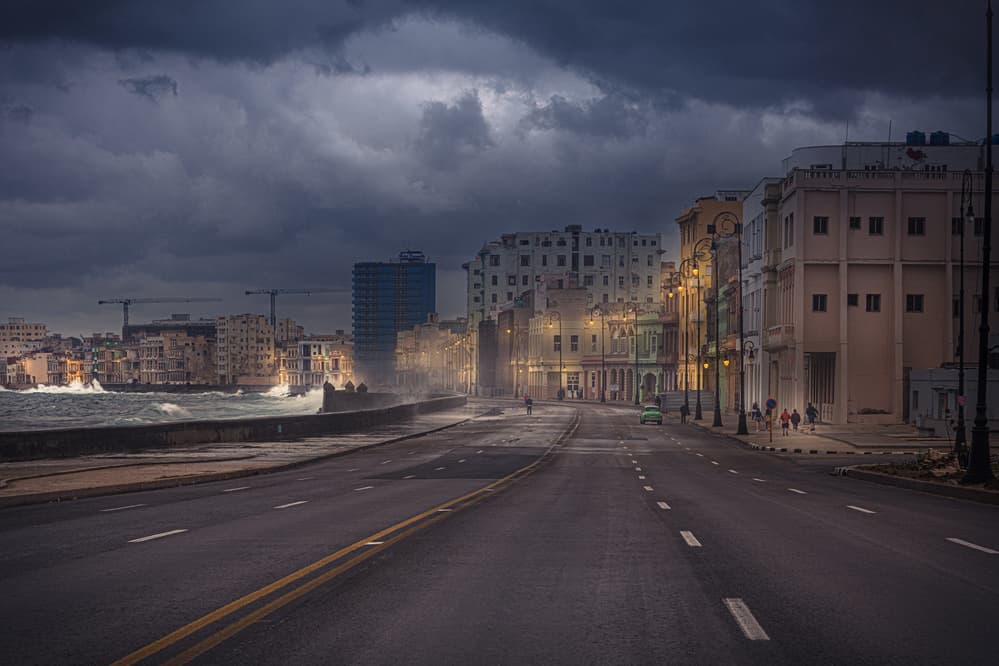 Stormy Coastal City Evening by Marco Tagliarino — canvas wall art