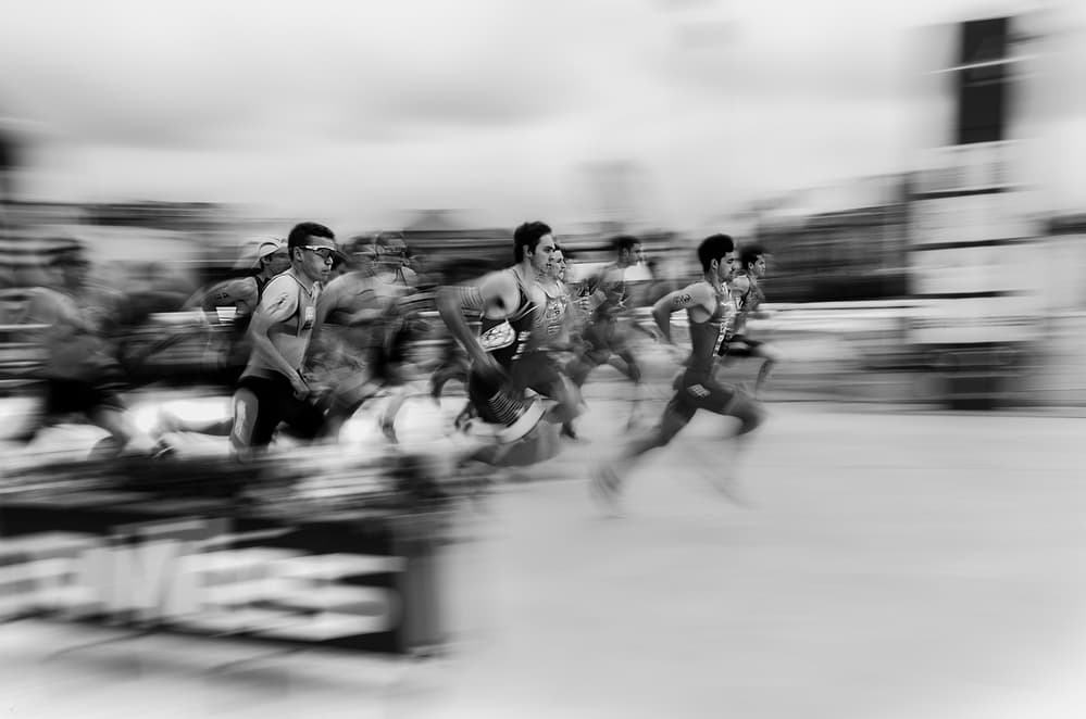 Runners In Full Stride by Carlos Gonzalez — canvas wall art