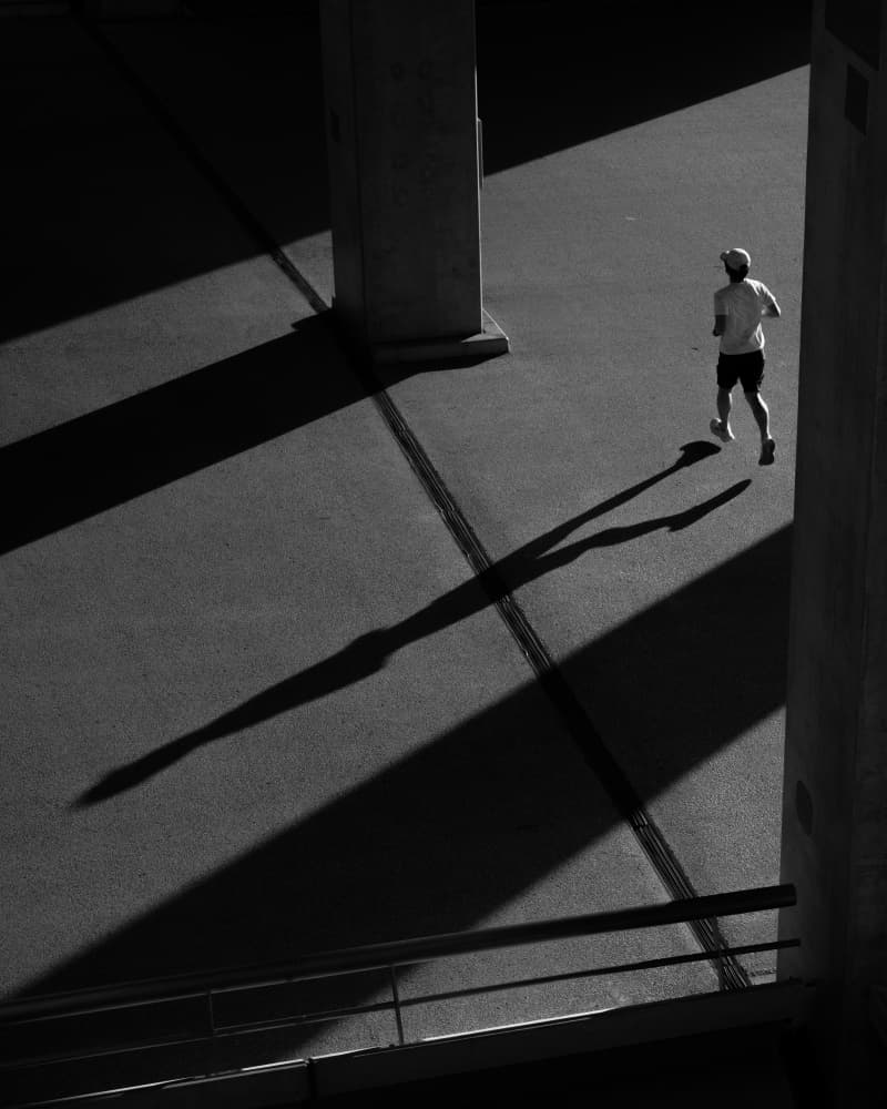 Solitary Runner's Shadow by Satoshi Hata — canvas wall art