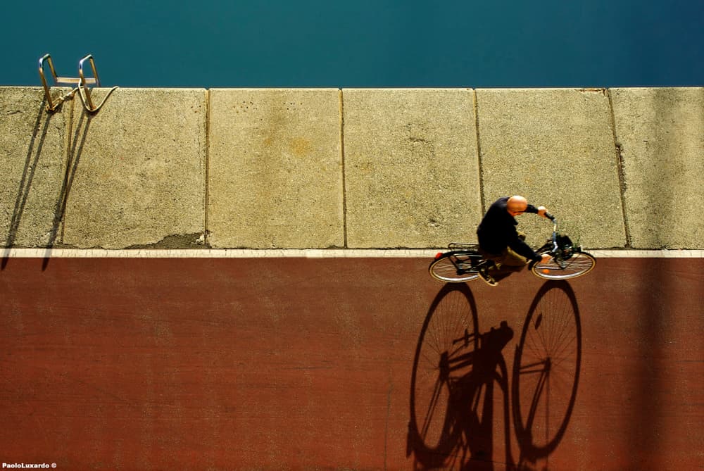 Urban Cyclist Shadow by paolo luxardo — canvas wall art