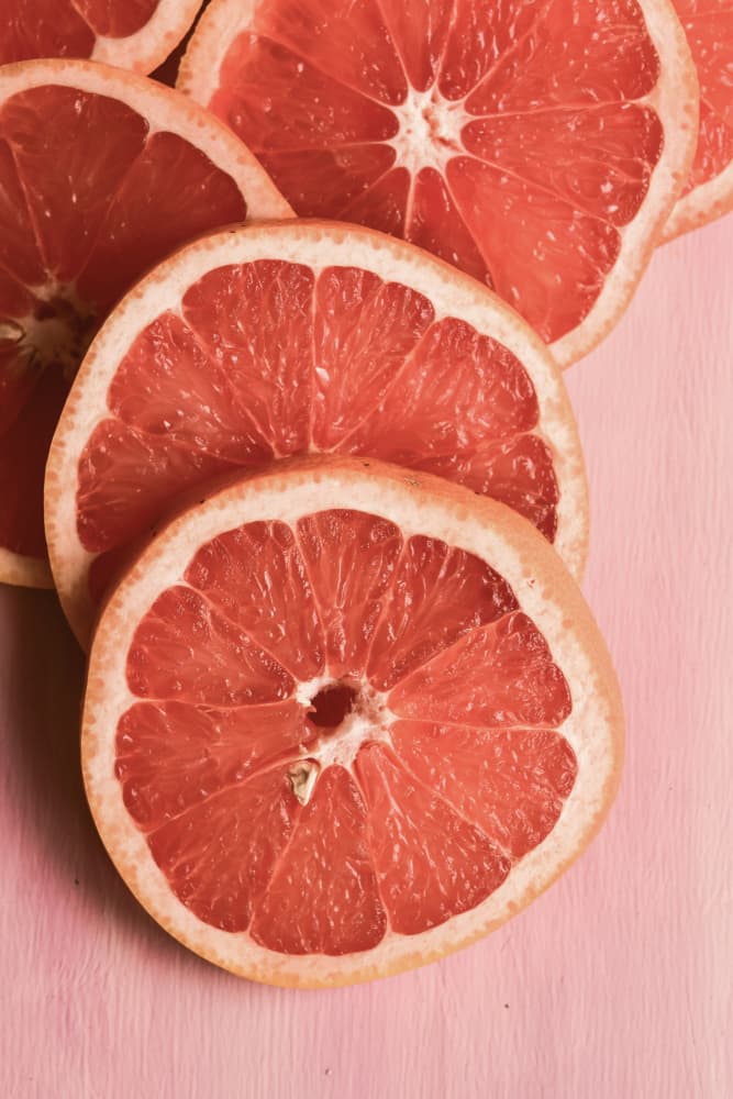 Vibrant Grapefruit Slices by Olivia Joy StClaire — canvas wall art