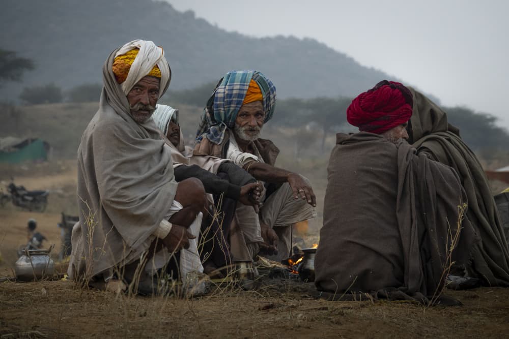 Rajasthani Elders by Fire by Elena Molina — canvas wall art