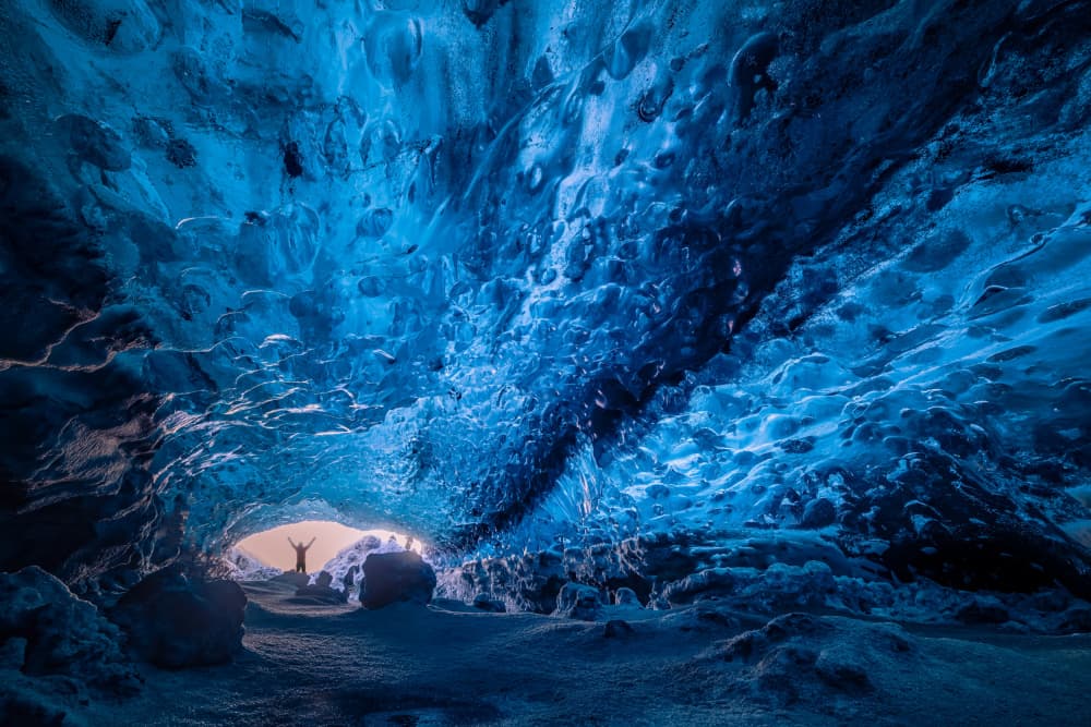 Blue Ice Cave Explorer by James Zhen Yu — canvas wall art