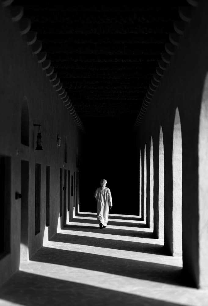 Solitary Walk Through Arches by Karim Al Thahaby — canvas wall art