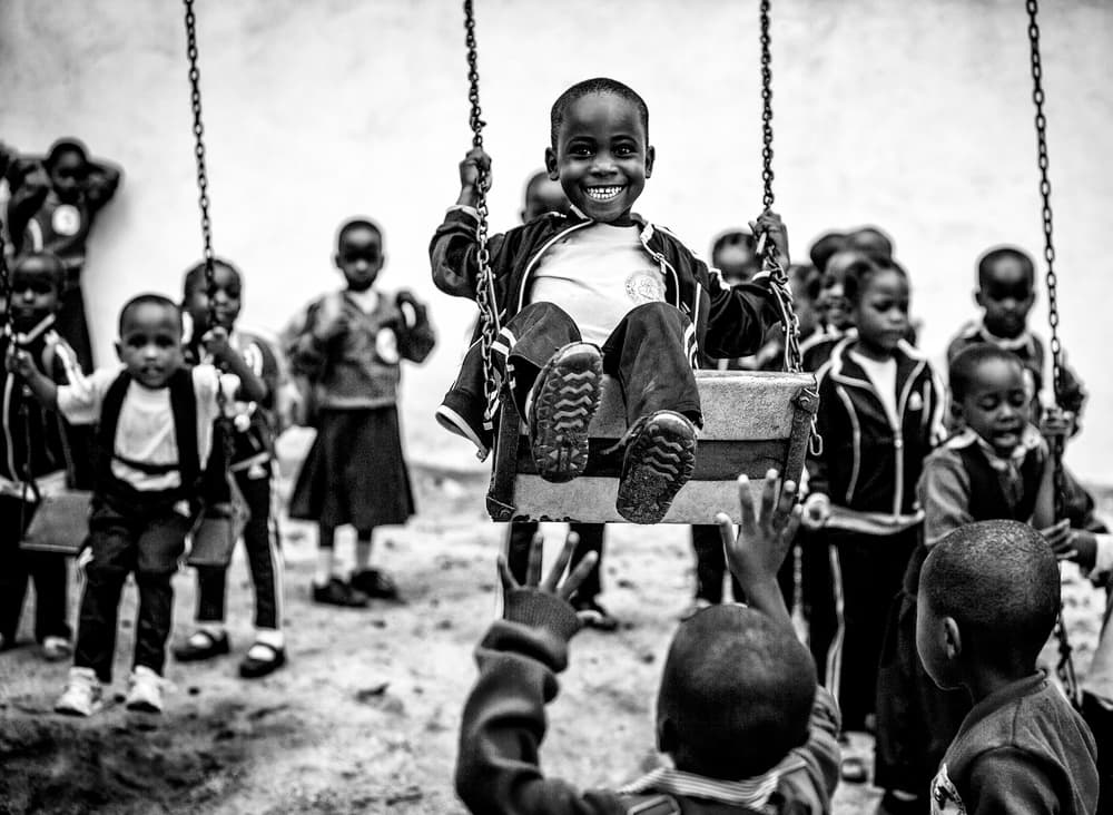 Smiling Boy On Swing by Vedran Vidak — canvas wall art