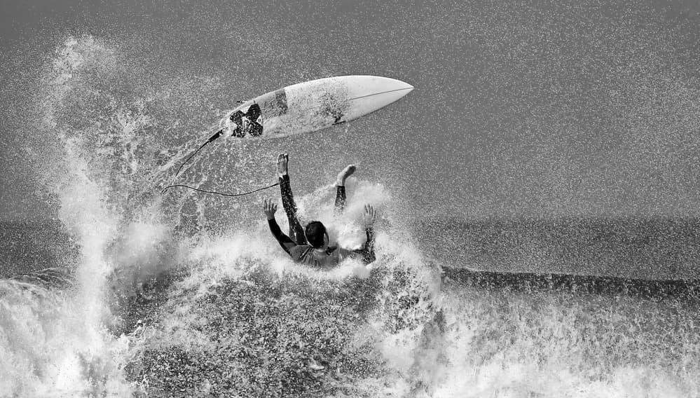Surfer in Crashing Wave by Eyal Bussiba — canvas wall art