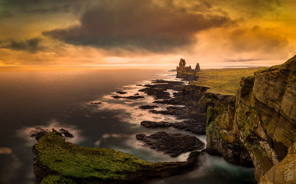 Dramatic Coastal Sunset by Juan I. Cuadrado — canvas wall art