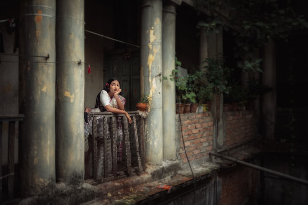 Pensive Balcony Gaze by Kuntal Biswas — canvas wall art