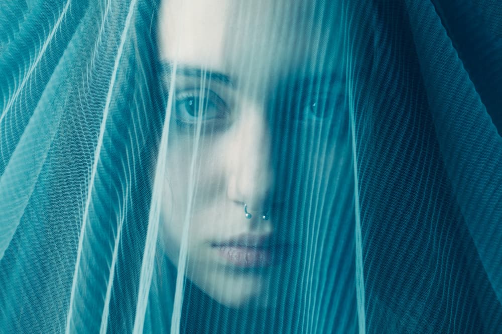 Woman Behind Blue Veil by Mehdi Mokhtari — canvas wall art