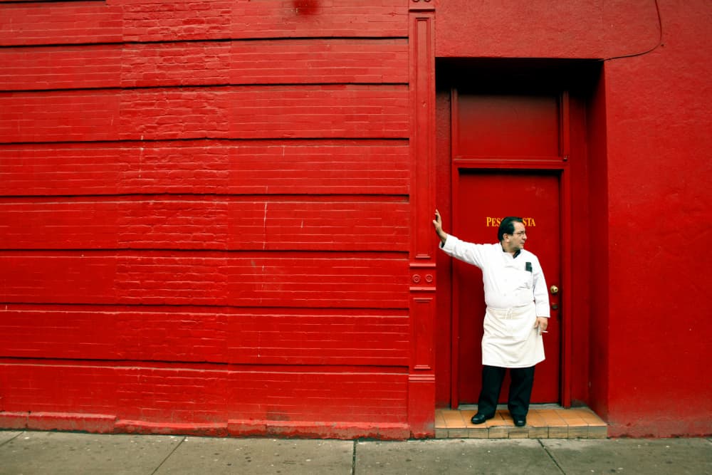 Chef in Red Doorway by Alessio Trerotoli — canvas wall art