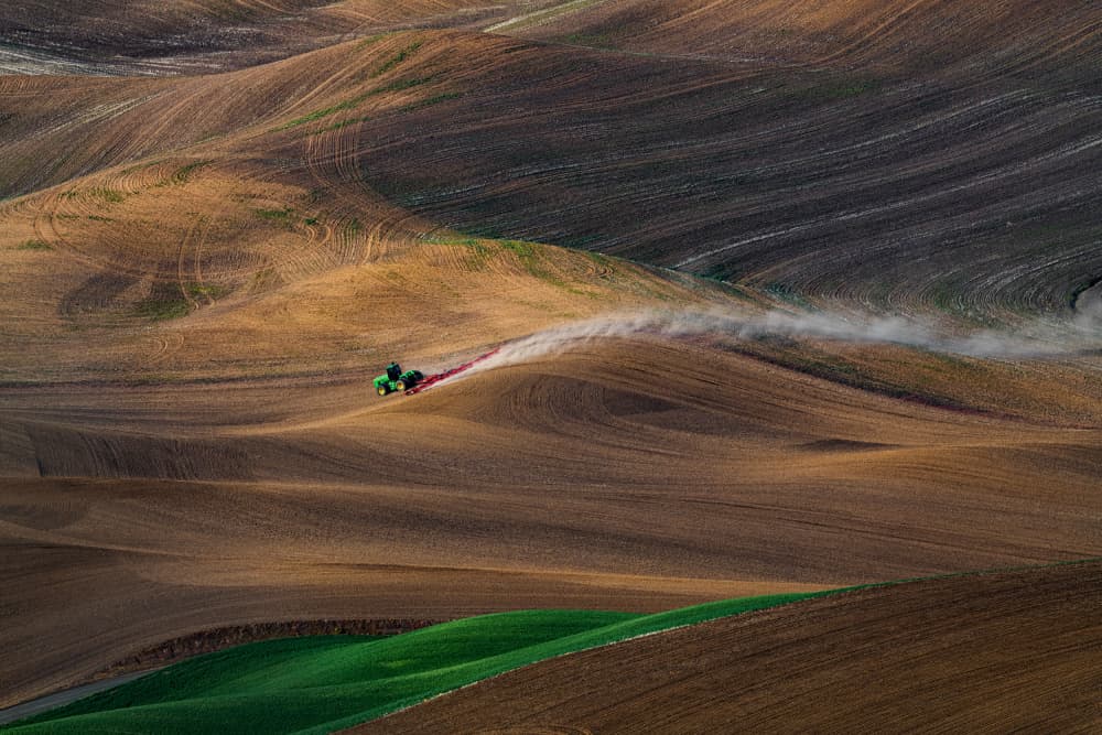 Tractor In Rolling Fields by Chuanxu Ren — canvas wall art