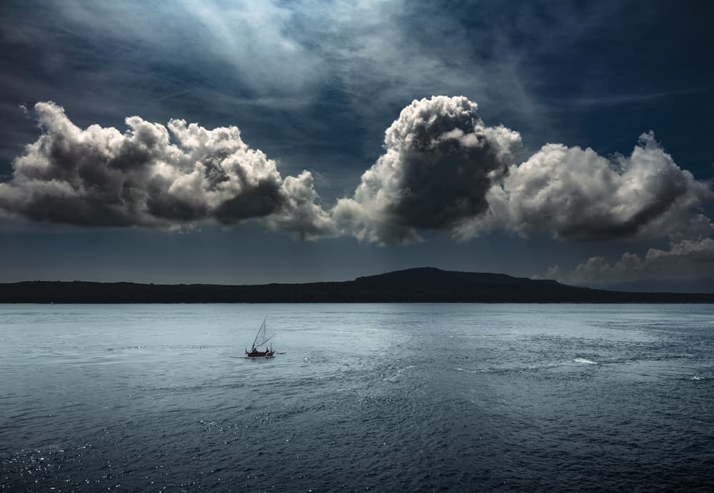 Distant Sailboat Moody Sea by Rudi Gunawan — canvas wall art