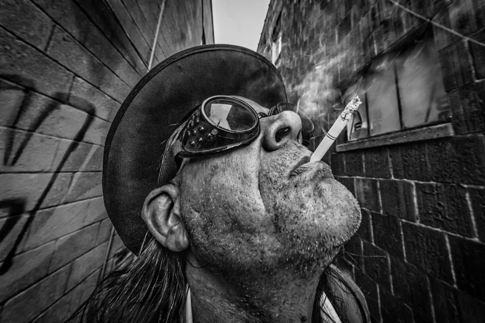 Man With Goggles Smoking by Steve Hermann — canvas wall art