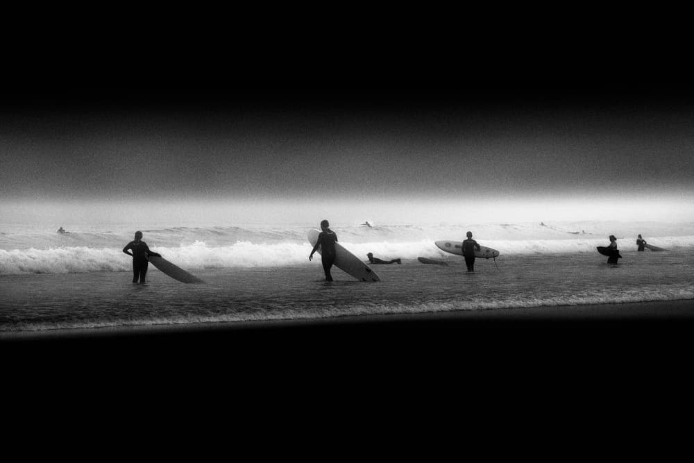 Misty Surfers Beach by Olavo Azevedo — canvas wall art