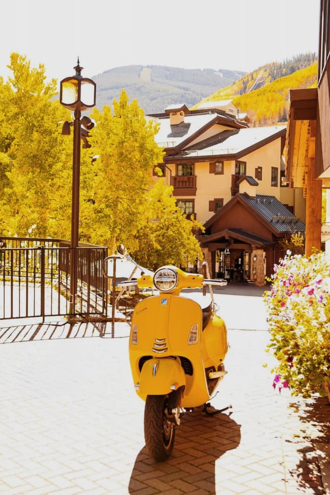 Yellow Vespa Mountain Village by Del Mundo Imagery — canvas wall art