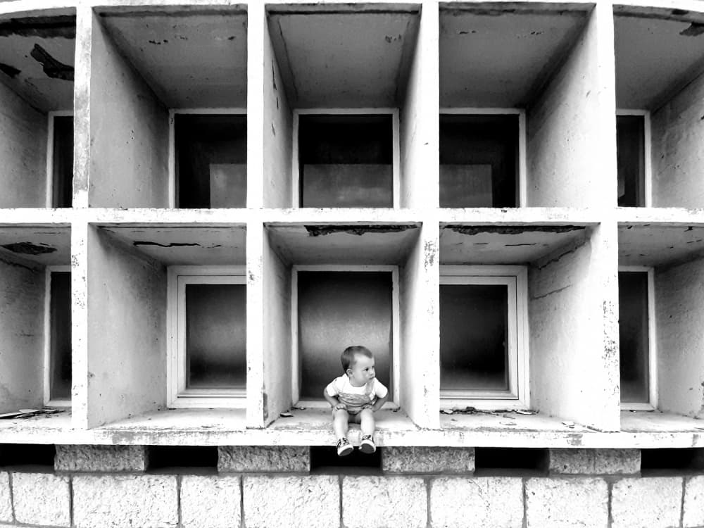 Little One in Concrete Grid by Marko Buntic — canvas wall art