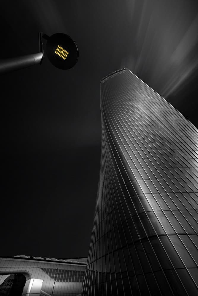 Curved Skyscraper Night by Domenico Petrocca — canvas wall art