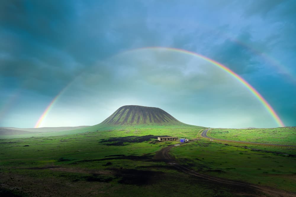 Rainbow Over Volcanic Landscape by Simoon — canvas wall art