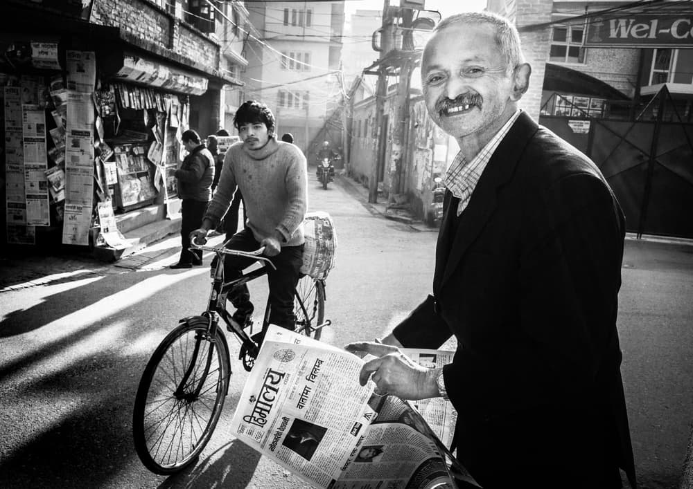 Smiling News Vendor by TORU MATSUNAGA — canvas wall art