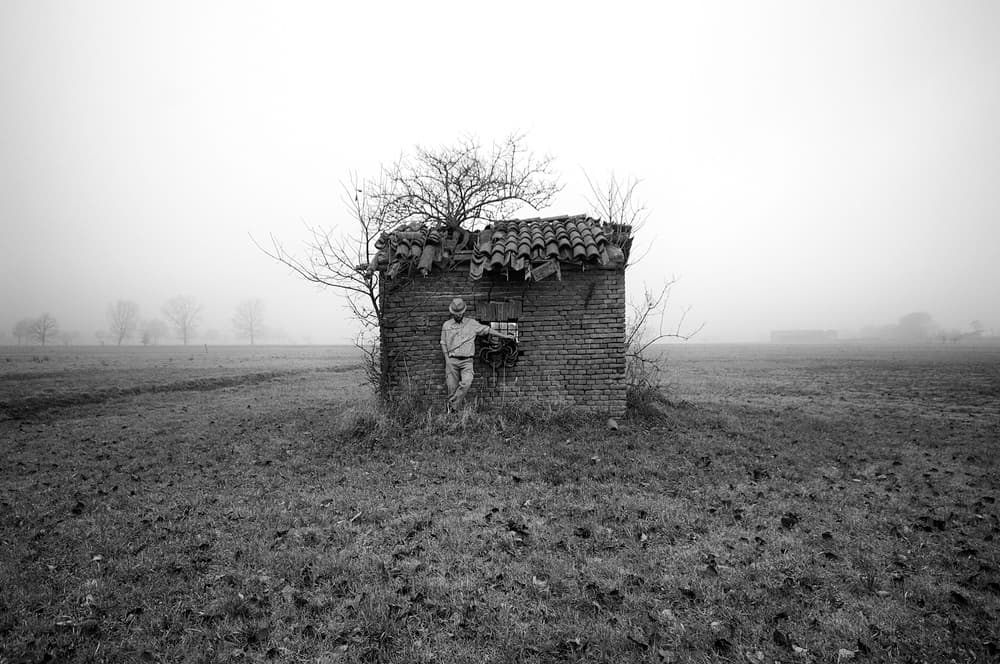 Solitary Figure Foggy Field by Carlo Ferrara — canvas wall art