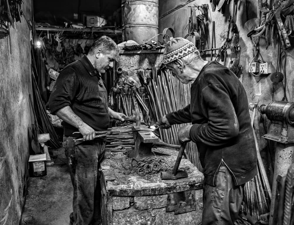 Blacksmiths at Work by Bashar Alsofey — canvas wall art