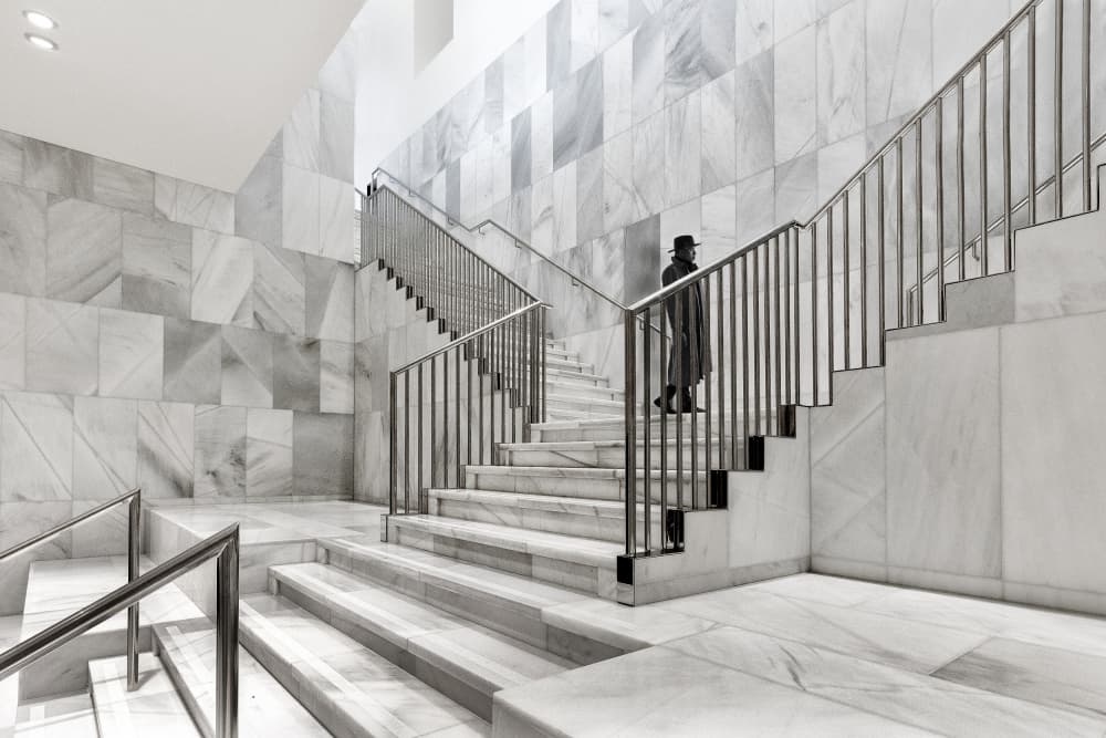 Man on Grand Marble Stairs by Wilma Wijers Smeets — canvas wall art