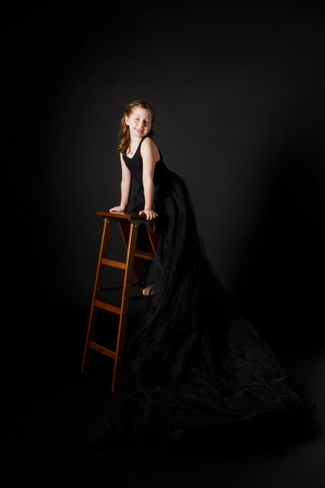 Playful Black Gown Portrait by Amalya Shandelman — canvas wall art