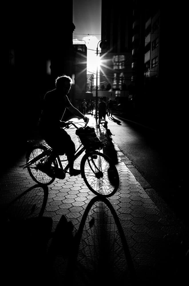 Sunlit City Cyclist by Kenichiro Tsukada — canvas wall art