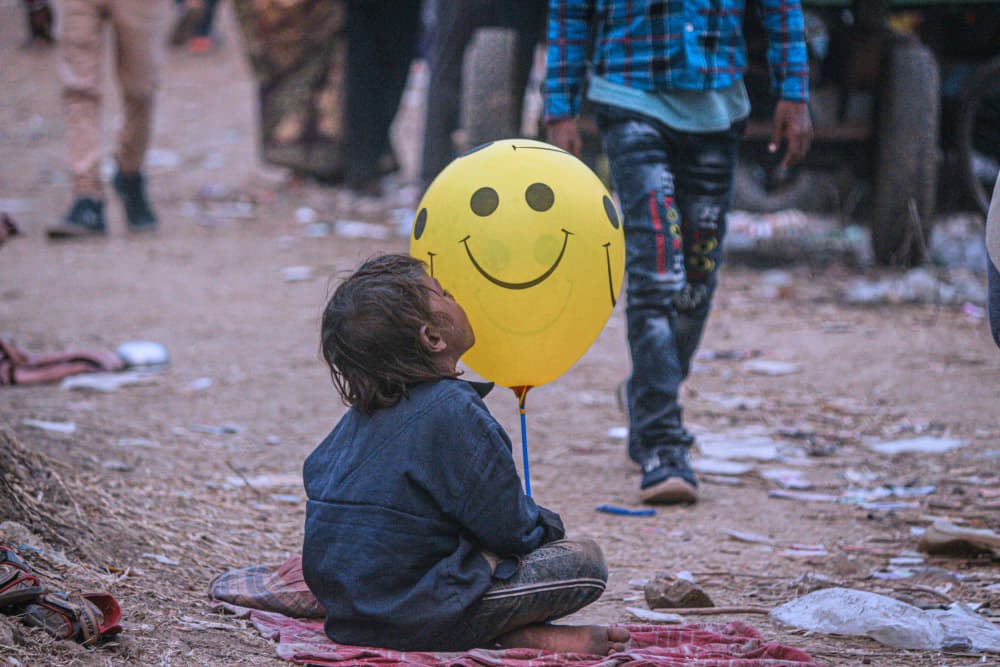 Smiley Balloon Boy by RAJA MANDAL — canvas wall art