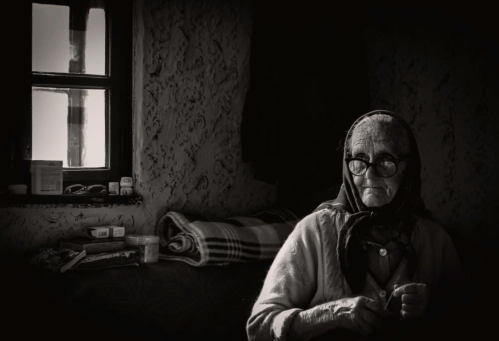 Elderly Woman By Window by RABIA BASHA ARTIST — canvas wall art