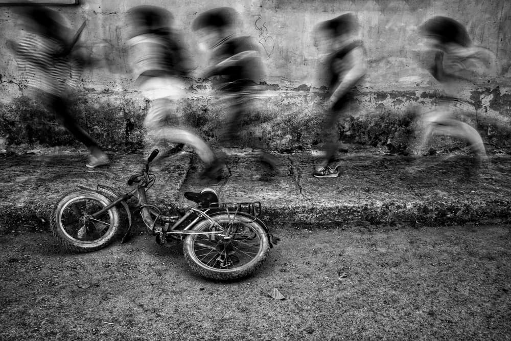 Running Children Street Scene by Ali Ayer — canvas wall art
