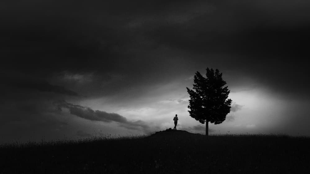 Solitary Figure Dark Sky by Claudio Moretti — canvas wall art