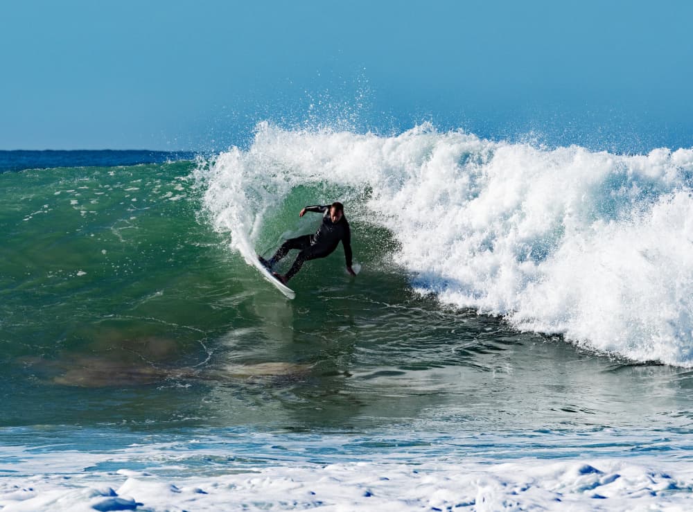 Surfer Carving Wave by Dirk Lombard — canvas wall art