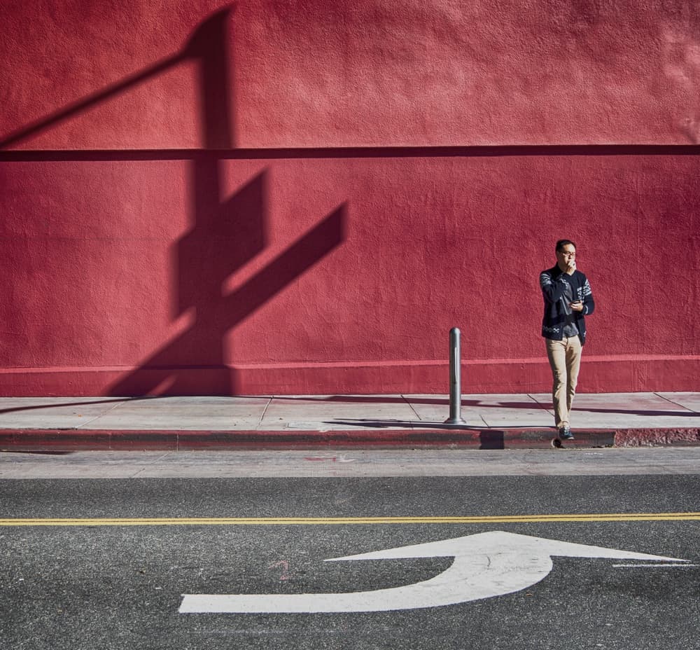 Red Wall Shadow Walk by Roxana Labagnara — canvas wall art