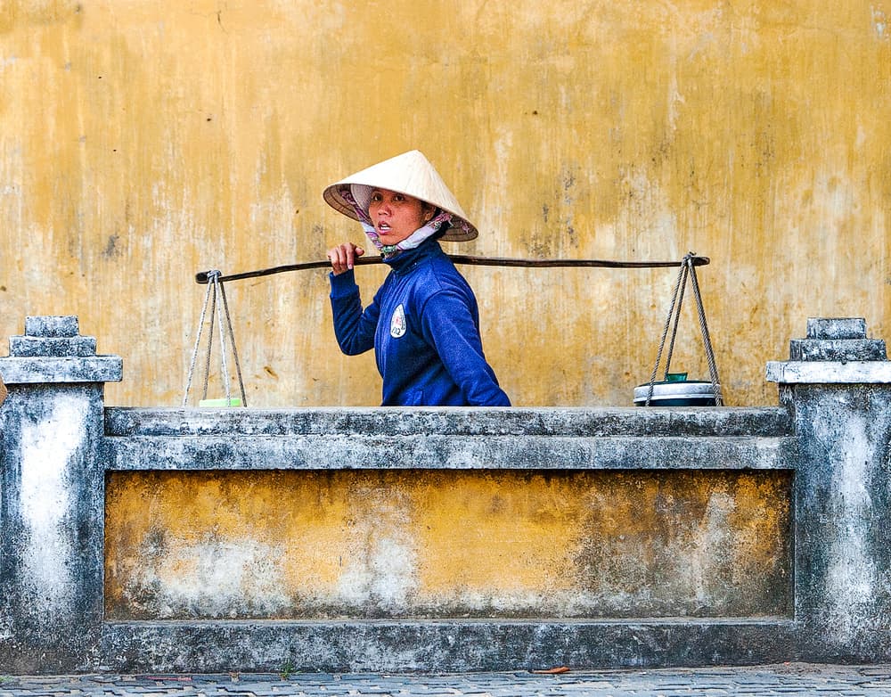 Vietnamese Woman Carrying Goods by Wayne Pearson — canvas wall art