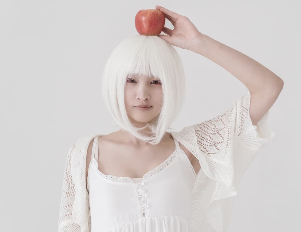 White Hair Red Apple by Suzuhiko Suzuki — canvas wall art